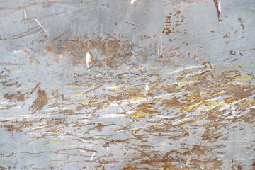metal surface with scratches and traces of paint