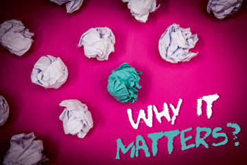 Text sign showing Why It Matters Question. Conceptual photo Important Reasons to do something Motivation Goal Ideas white blue letters pink background crumpled papers several tries