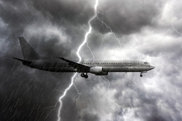 Airplane during heavy rain, storm with thunderstorm lightning, stormy weather on the backdrop