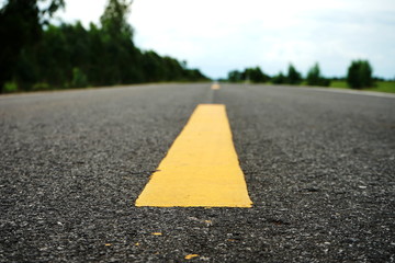 Road traffic paint Yellow on the asphalt surface