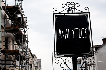 Word writing text Analytics. Business concept for Data Analysis Financial Information Statistics Report Dashboard Vintage black board sky old city vintage antique ideas message scaffolding