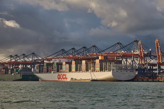 PORT OF ROTTERDAM, THE NETHERLANDS - SEPTEMBER 15, 2017: OOCL Hong Kong in the Port of Rotterdam. Biggest container ship in the world (as of 2017). 21,413 TEU Capacity.