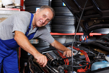 Mechanic engaged in car repair