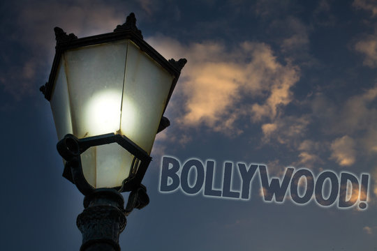 Conceptual hand writing showing Bollywood Motivational Call. Business photo showcasing Hollywood Movie Film Entertainment Cinema Light post blue sky enlighten ideas message feelings thought