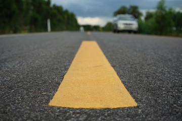 Obraz premium Road traffic paint Yellow on the asphalt surface
