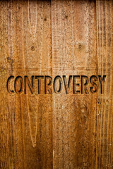 Text sign showing Controversy. Conceptual photo Disagreement or Argument about something important to people Ideas messages wooden background intentions feelings thoughts communicate