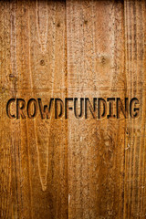 Text sign showing Crowdfunding. Conceptual photo Funding a project by raising money from large number of people Ideas messages wooden background intentions feelings thoughts communicate