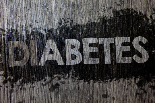 Text sign showing Diabetes. Conceptual photo Chronic disease associated to high levels of sugar glucose in blood Wooden wood background black splatter paint ideas messages intentions