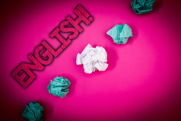 Conceptual hand writing showing English Motivational Call. Business photo text Relating to England its People or their Language Ideas messages pink background crumpled papers several tries