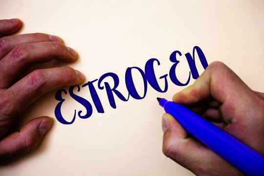 Conceptual hand writing showing Estrogen. Business photo showcasing Group of hormones promote the development of female characteristics Man holding blue marker white background ideas inspiration