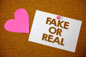 Handwriting text Fake Or Real. Concept meaning checking if products are original or not checking...