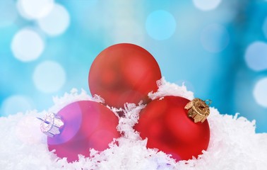 Christmas balls in snowflakes on white background