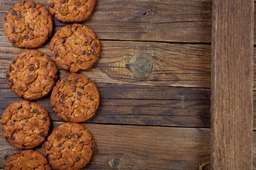  cookies with chocolate on a wooden background with free space
