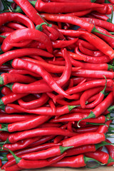 red chili peppers on wooden background