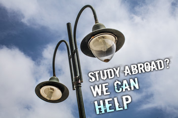 Text sign showing Study Abroad Question We Can Help. Conceptual photo going overseas complete your studies Double Light post sky enlighten ideas message cloud cloudy beautiful