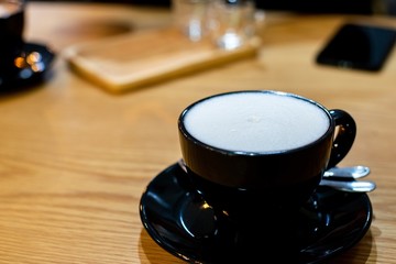hot milk on the wooden table