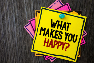 Text sign showing What Makes You Happy Question. Conceptual photo Happiness comes with love and positive life Wooden background ideas messages intentions reflections communicate inform