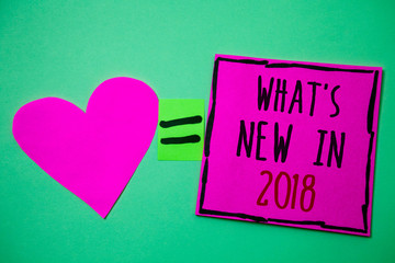 Text sign showing What'S New In 2018. Conceptual photo Year resolution Goals Career achievements Technology Hart memories love pink green background love lovely thoughts message