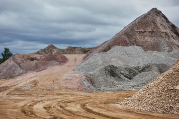 Industrial quarry with mountains of sand and rubble