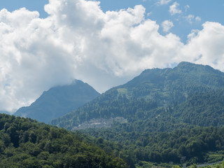 Beautiful mountains in clouds in the red meadow of Sochi