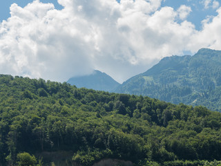 Beautiful mountains in clouds in the red meadow of Sochi