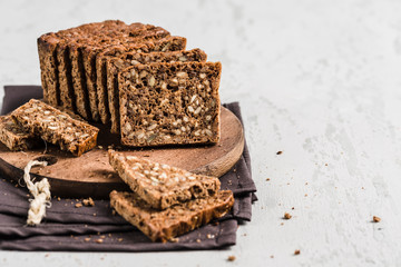 Gluten-free bread with hazelnut and flax seeds on a wooden Board