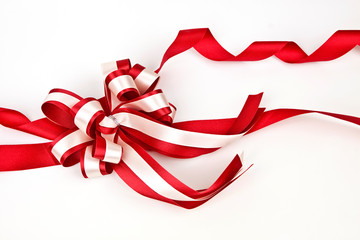 Red bow with shadow on a white background
