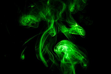 Green smoke on black background