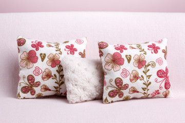 Pillows on the sofa with floral ornament