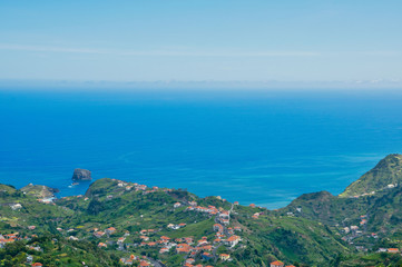 Fototapeta na wymiar Viewpoint Portela, view to Atlantic ocean in summer sunny day near Machico and Porto da Cruz, Madeira island, Portugal