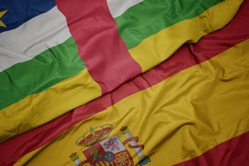 waving colorful flag of spain and national flag of central african republic.