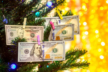 Christmas tree decorated with dollar bills. Wishes  Wealth in the New Year_