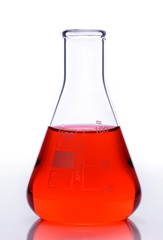 Scientific laboratory glass with red chemical liquid