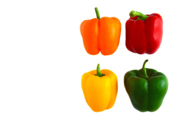Fresh  organic vegetables. Orange, yellow, green, red bell peppers or capsicum isolated on white background, copy space