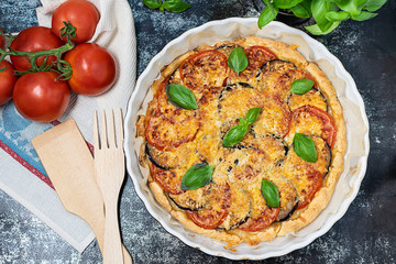 Traditional French kish pie with vegetables and cheese top view.