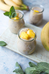 Beautiful and tasty dessert with mango and seeds of a chia. A fresh pudding with fruit for breakfast