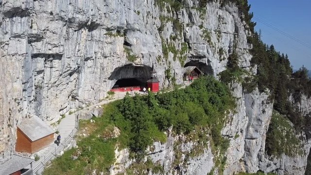 Flight around Wildkirchli (Wild Chapel) caves in the rock on Ebenalp, Canton of Appenzell, Switzerland
