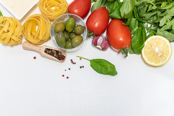 Creative flat lay overhead composition with fresh organic ingredients for preparing Italian pasta with copy space for your design. 