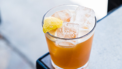 Cocktail with lemon peel