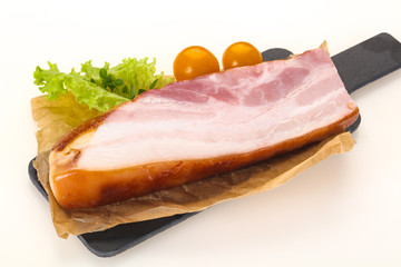 Smoked pork breast with salad leaves