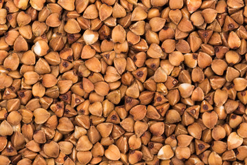 Macro Photo food buckwheat groats. Texture background grain buckwheat groats. Image food product porridge buckwheat grains
