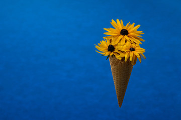 art bouquet in a waffle cone