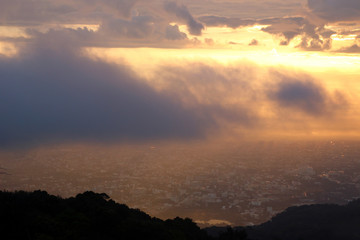 View on a city from mountain with beautiful colorful sky at sunrise. Doi Suthep, Thailand