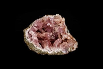 Macro mineral stone Pink Amethyst on a black background