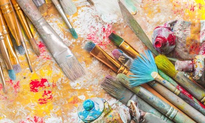 Row of artist paint brushes  on background