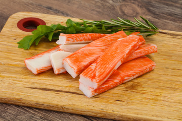 Crab stick surimi over board