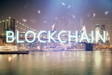 Multi exposure of cryptocurrency theme hologram drawing and city veiw background. Concept of blockchain and bitcoin.