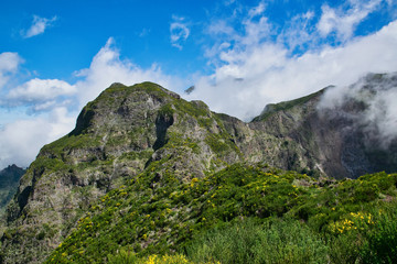 View from the hiking trail at the Boca da Corrida belvedere on the Encumeada pass on Madeira Island, Portugal in summer, View to the village of Curral das Freiras 