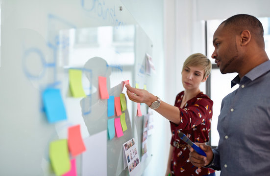 Diverse team of creative millennial coworkers in a startup brainstorming strategies
