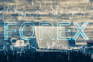 Double exposure of forex graph and work space with computer. Concept of international online trading.